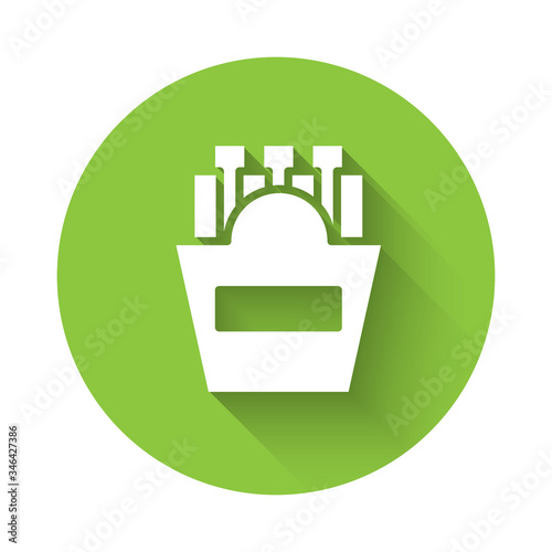 White Potatoes french fries in carton package box icon isolated with long shadow. Fast food menu. Green circle button. Vector Illustration