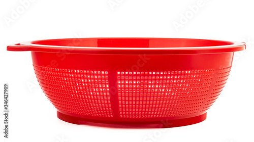 red colander for cooking in the kitchen