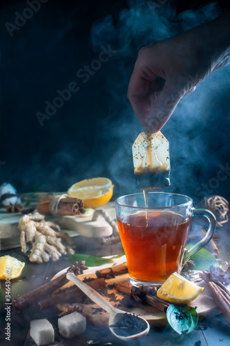 Transparent cup of tea with steam. ingredients for tea