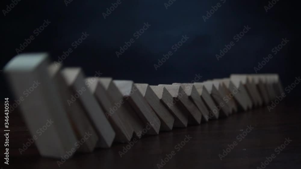 domino effect and overturning wooden blocks. slow motion.