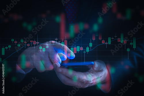 Businessman checking stock market data using a mobile phone. Analysis economy and market data analytics concept
