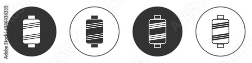 Black Sewing thread on spool icon isolated on white background. Yarn spool. Thread bobbin. Circle button. Vector Illustration