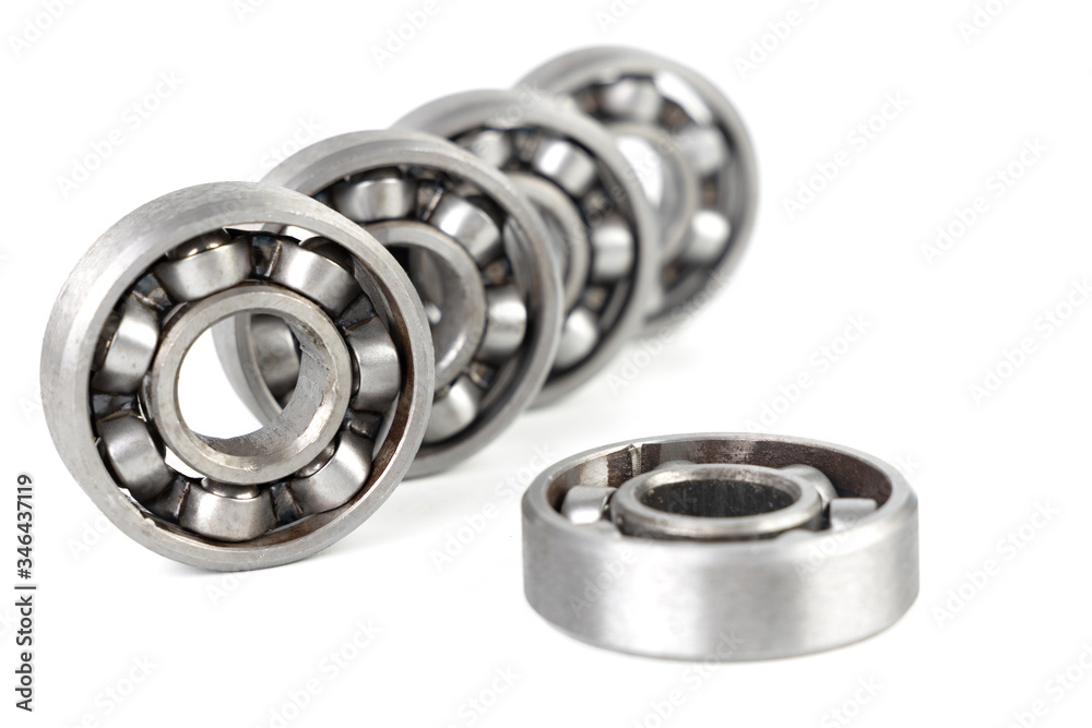 Set of various metal rolling bearing spare part of mechanical on white background. Set of various metal rolling bearing spare part of mechanical on white background.