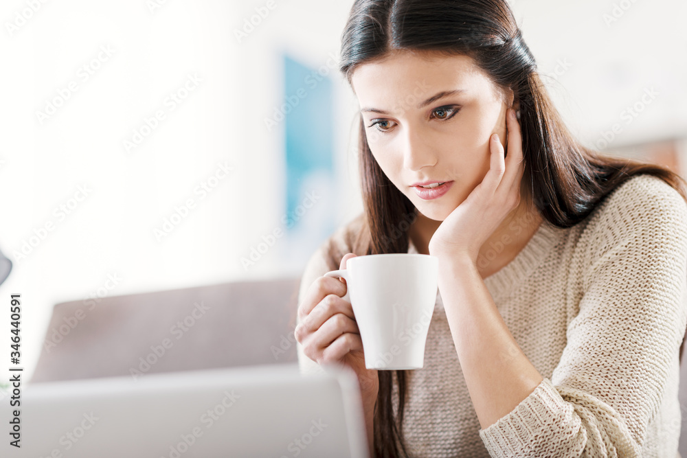 Girl watching a movie online Girl watching a movie online
