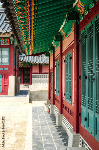 Interior of Gyeongbokgung palace building painted with Dancheong art, Korean traditional decorative painting on wooden buildings and artifacts with five colors: blue, white, red, black, yellow. © Lisa