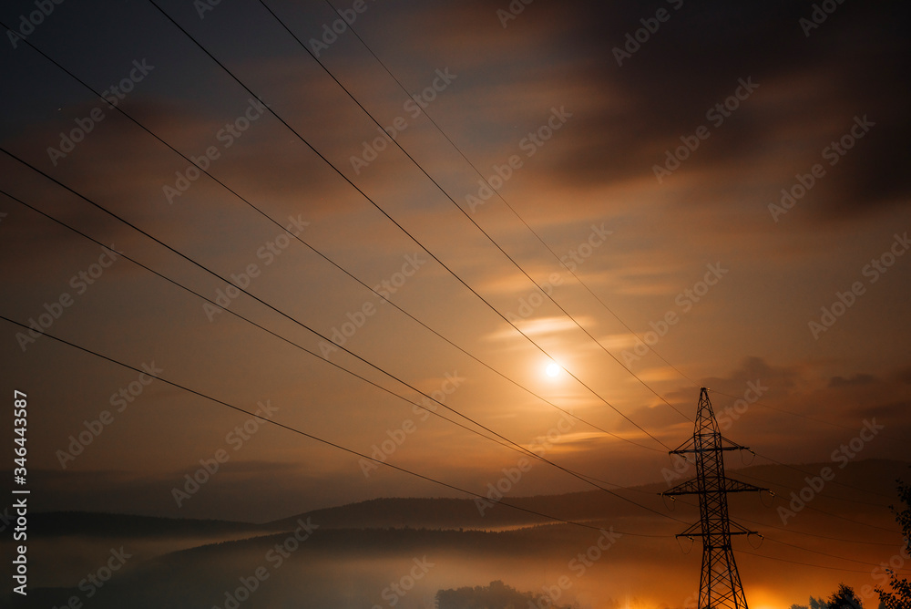 Power line at sunset. Electricity