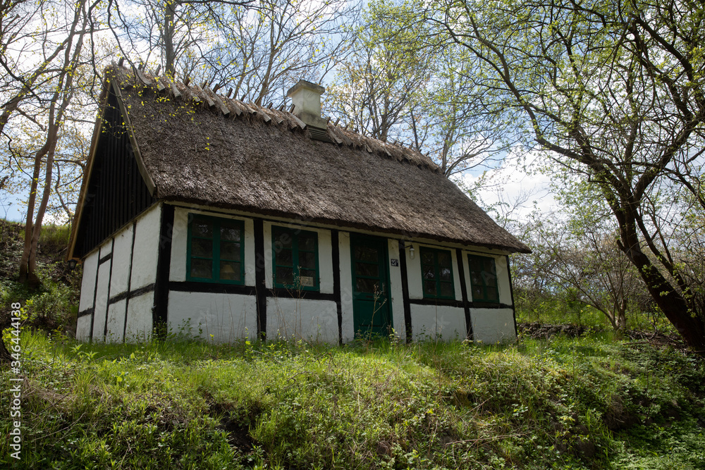 old danish house with trees and blue sky old danish house with trees and blue sky