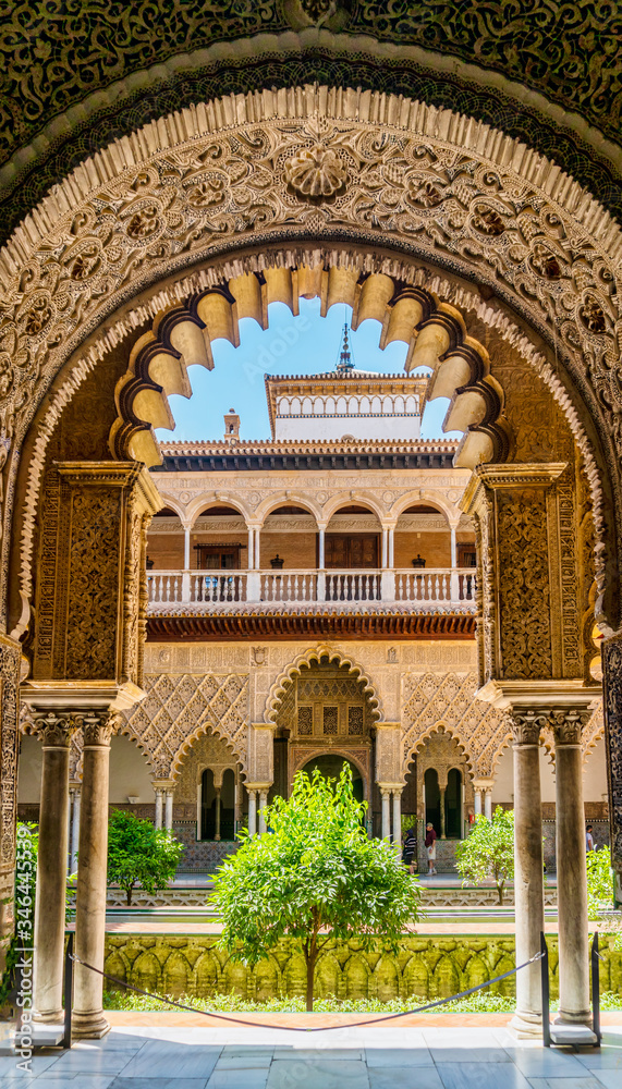 Moorish architecture of beautiful castle called Real Alcazar in Seville, Spain