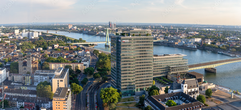 modern building and severins bridge on a warm summer day in cologne