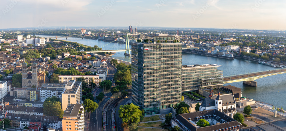 Naklejka premium modern building and severins bridge on a warm summer day in cologne