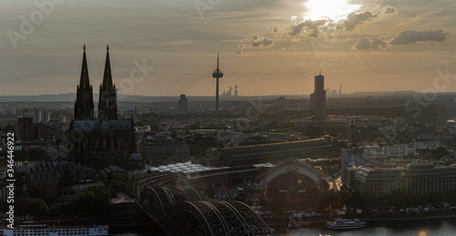 sunset over Colonius telecommunications tower hohenzollern bridge and cologne cathedral photo