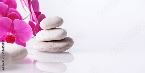 Wellness  relax  massage and wellbeing concept. Spa stones and orchid flower over white background.