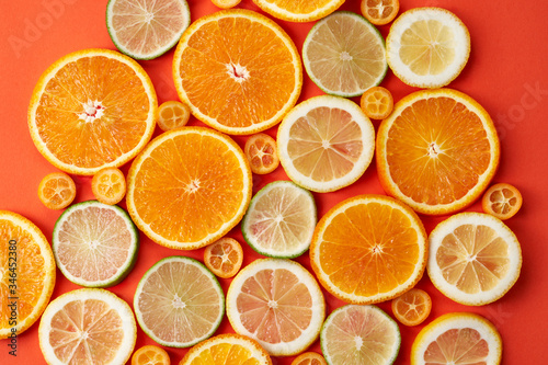 Selection of citrus slices on paper background 2