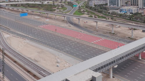 Wallpaper Mural Aerial view of empty highway and interchange in Dubai after epidemic lockdown. Cityscapes with disappearing traffic on streets. Roads and lanes crossroads without cars in Dubai Marina and JLT, United Torontodigital.ca