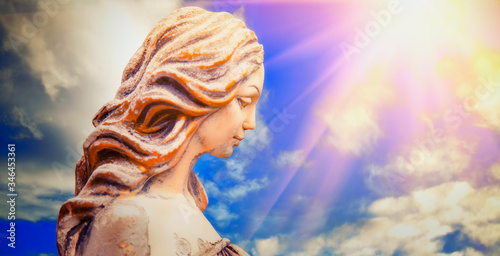 Fragment of ancient statue of Olympic goddess of love and beauty in antique mythology Aphrodite (Venus). photo