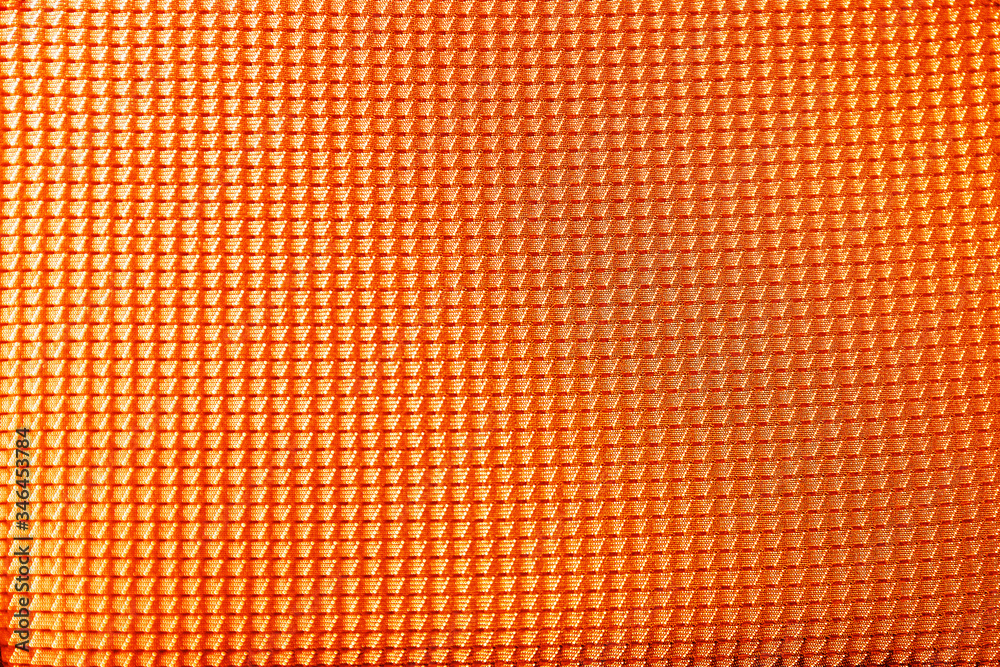 Textured orange fabric as background, closeup view Textured orange fabric as background, closeup view