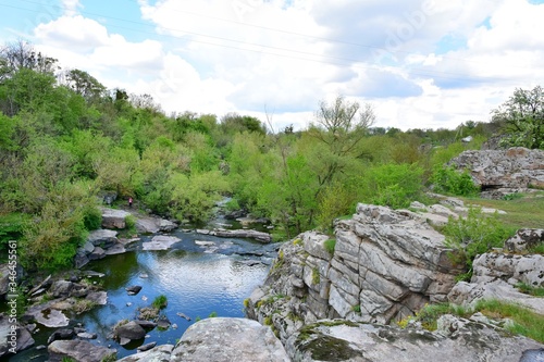 Amazing granite Buky canyon Cherkasy region, Ukraine. Granite canyon in Buki. Ukrainian landmarks. Domestic tourism. Sheer banks and a mountain river, extreme tourism. River rafting 