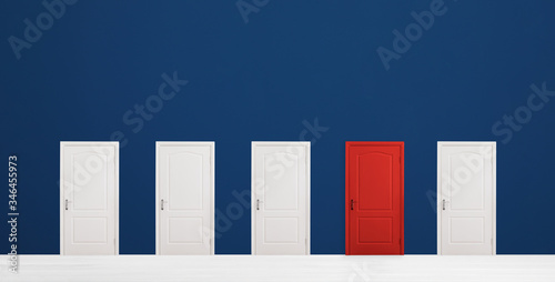 Red door among white ones in room. Concept of choice photo