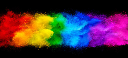 colorful rainbow holi paint color powder explosion garland banner isolated  dark black wide panorama background. peace rgb beautiful party concept