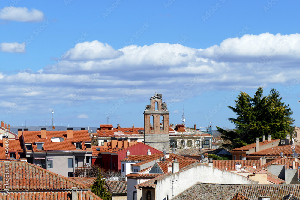 Roofs and chimneys in Spain, with some storks on their nest