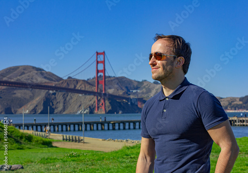 Young man in San Francisco by Golden Gate Bridge. Golden gate bridge. Travel to California.