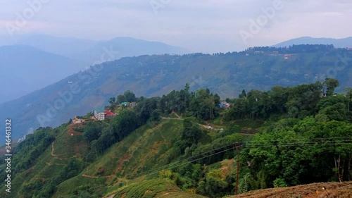 View of the hills and tea gardens of Darjeeling from the cable car in North India photo