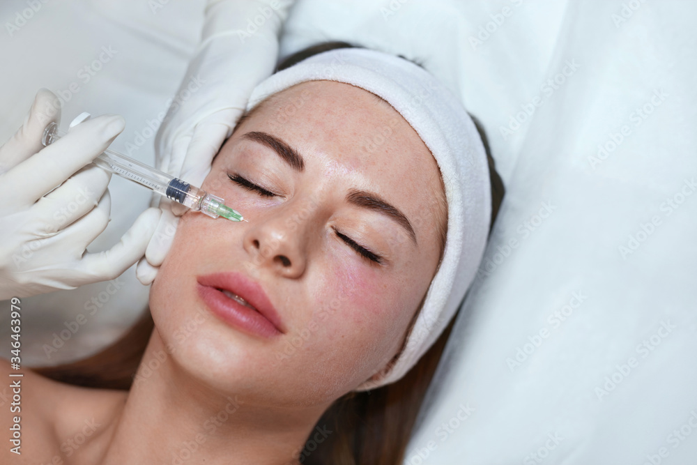 Face Treatment. Beauty Injection Near Eyes. Female Skincare  Procedure In Cosmetic Clinic. Beautician Hands In Gloves With Syringe.