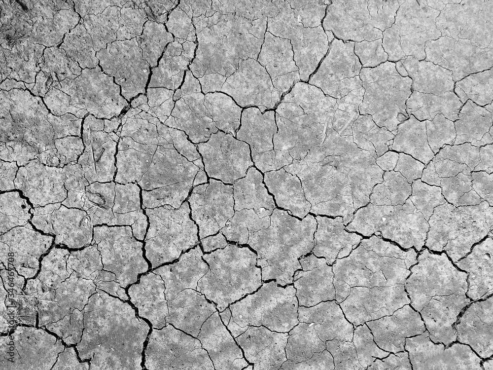 high angle view of crack soil ground in black and white photography