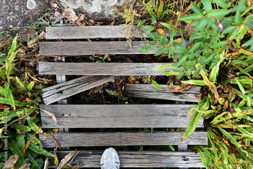 Ταπετσαρία old and dirty broken wood bridge on walk way