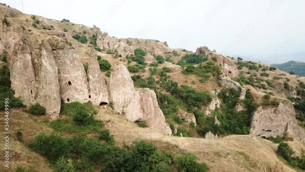The Old Caves Of Khndzoresk In The Syunik Region Of Armenia - Beautiful Natural Scenery - aerial drone The Old Caves Of Khndzoresk In The Syunik Region Of Armenia - Beautiful Natural Scenery - aerial drone