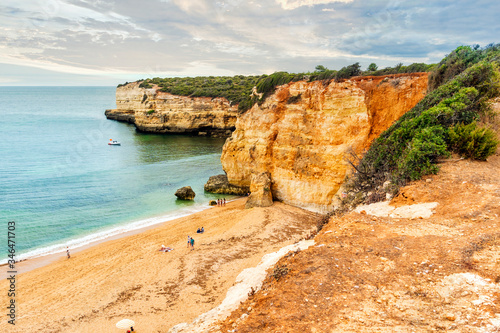 Beautiful sandy beach surrounded with cliffs in Porches, Algarve, Portugal