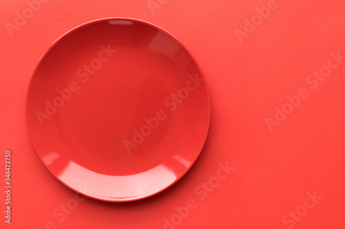 Red plate on a red background, the basis for design