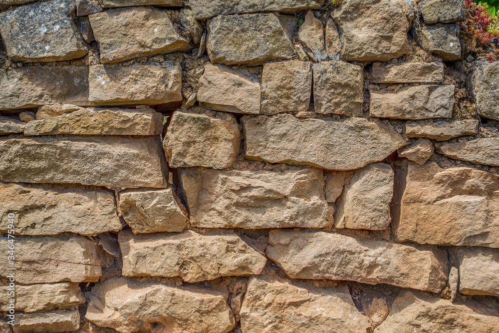 Fototapeta premium stone wall as a natural field background