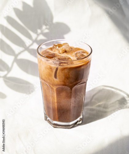 Milk cream iced coffee cold brew. Coffee cold drink cocktail with ice and milk.