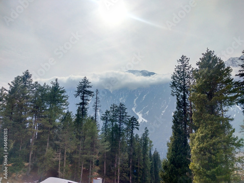 time lapse clouds over the mountain photo