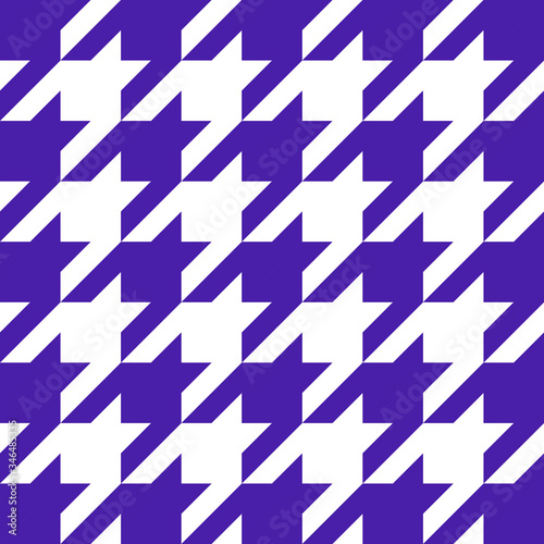 Goose foot. Pattern of crow's feet in violet and white cage. Glen plaid. Houndstooth tartan tweed. Dogs tooth. Scottish checkered background. Seamless fabric texture. Vector illustration