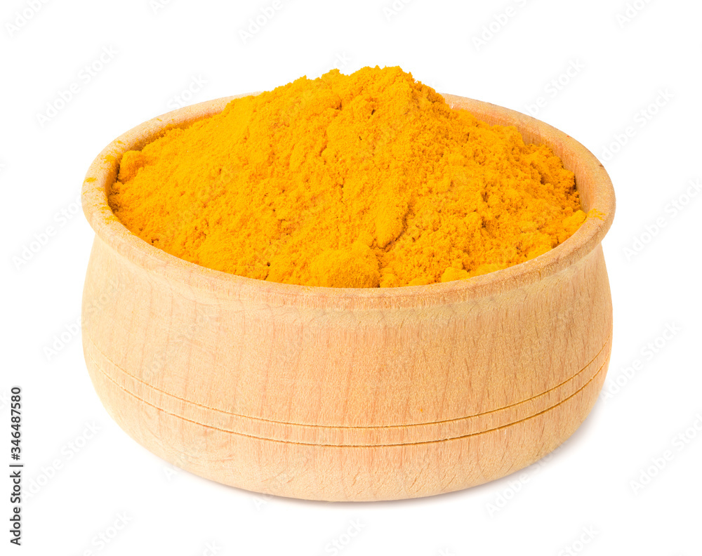 Turmeric powder in wooden bowl isolated on white background Turmeric powder in wooden bowl isolated on white background