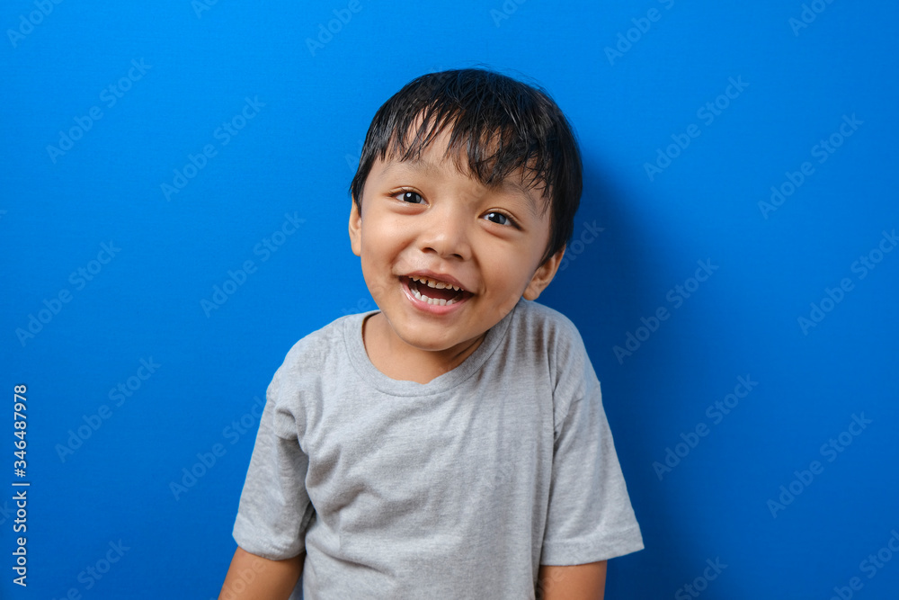 Smiling young muslim boy in grey t-shirt Smiling young muslim boy in grey t-shirt