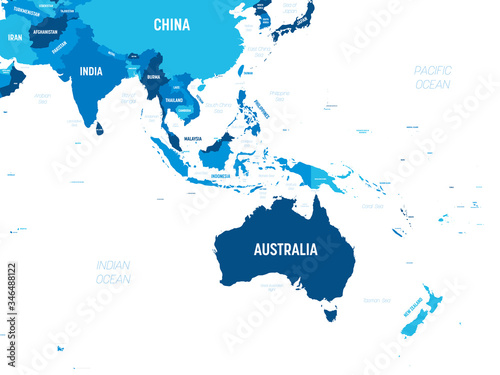 Australia and Southeast Asia map - green hue colored on dark background. High detailed political map of australian and southeastern Asia region with country, capital, ocean and sea names labeling