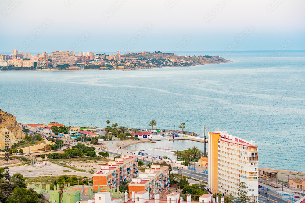 Panoramic view of Alicante, Valencian Community, Spain. In the foreground the Castle of Santa Barbara, the Postiguet beach and the port in the background with the city on its shore 