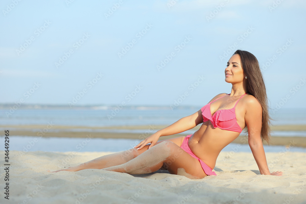 Beautiful girl in bikini on the beach