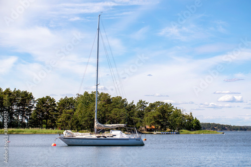  Sweden. White yacht under a blue summer sky