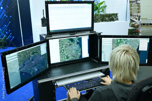 Military computer-assisted dispatch station for reconnaissance and coordination units, monitors and operator working