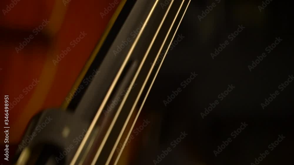 Cello before playing at a concert. Musical instrument close-up shooting of details. Customize your music. Cello before playing at a concert. Musical instrument close-up shooting of details. Customize your music.