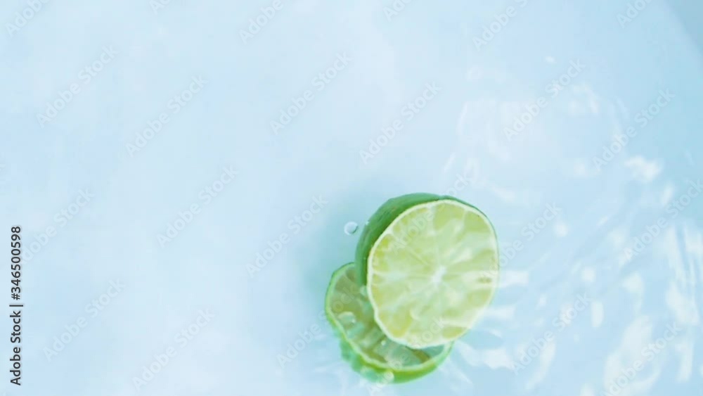 Lemon falling into the water, white background Lemon falling into the water, white background