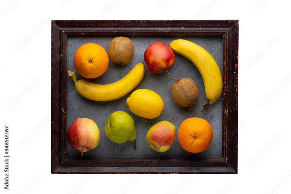 Old photo frame with a set of fresh fruits isolated on a white background. Old photo frame with a set of fresh fruits isolated on a white background.