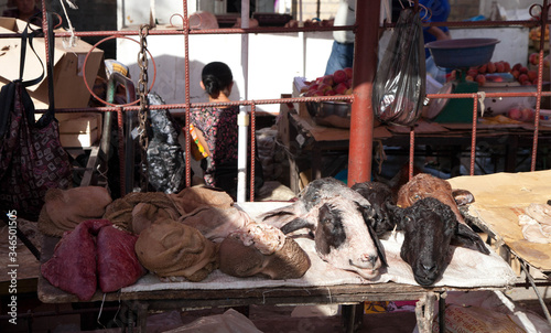 Counter at the food market. Sheep's heads. Meat sale. photo