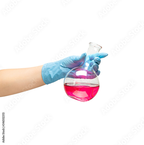 Female hands in a blue rubber glove holds a flask of red medicine on white background isolate.