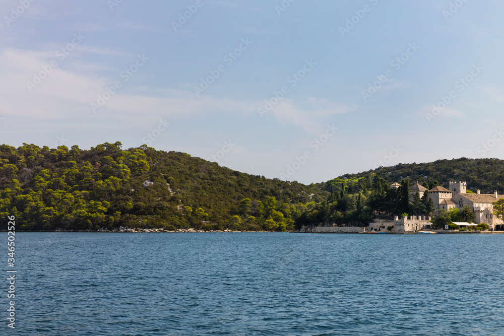 Small island view of Saint Mary Monastery at Mljet, Melita  malo jezero, the beautiful salt water lakes and the National Park unesco, calm and peaceful nature landscape at the mediterranean coast