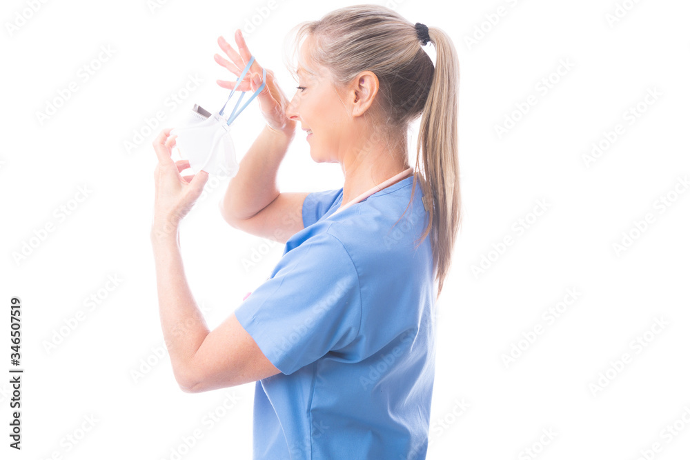 Nurse or healthcare worker putting on a N95 mask Nurse or healthcare worker putting on a N95 mask